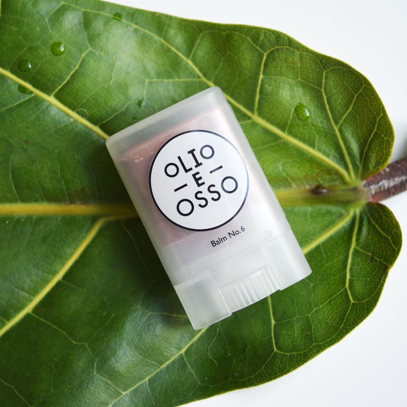 Olio E Osso Lip & Cheek Balm, pictured on a fig leaf, best multipurpose clean lip balms