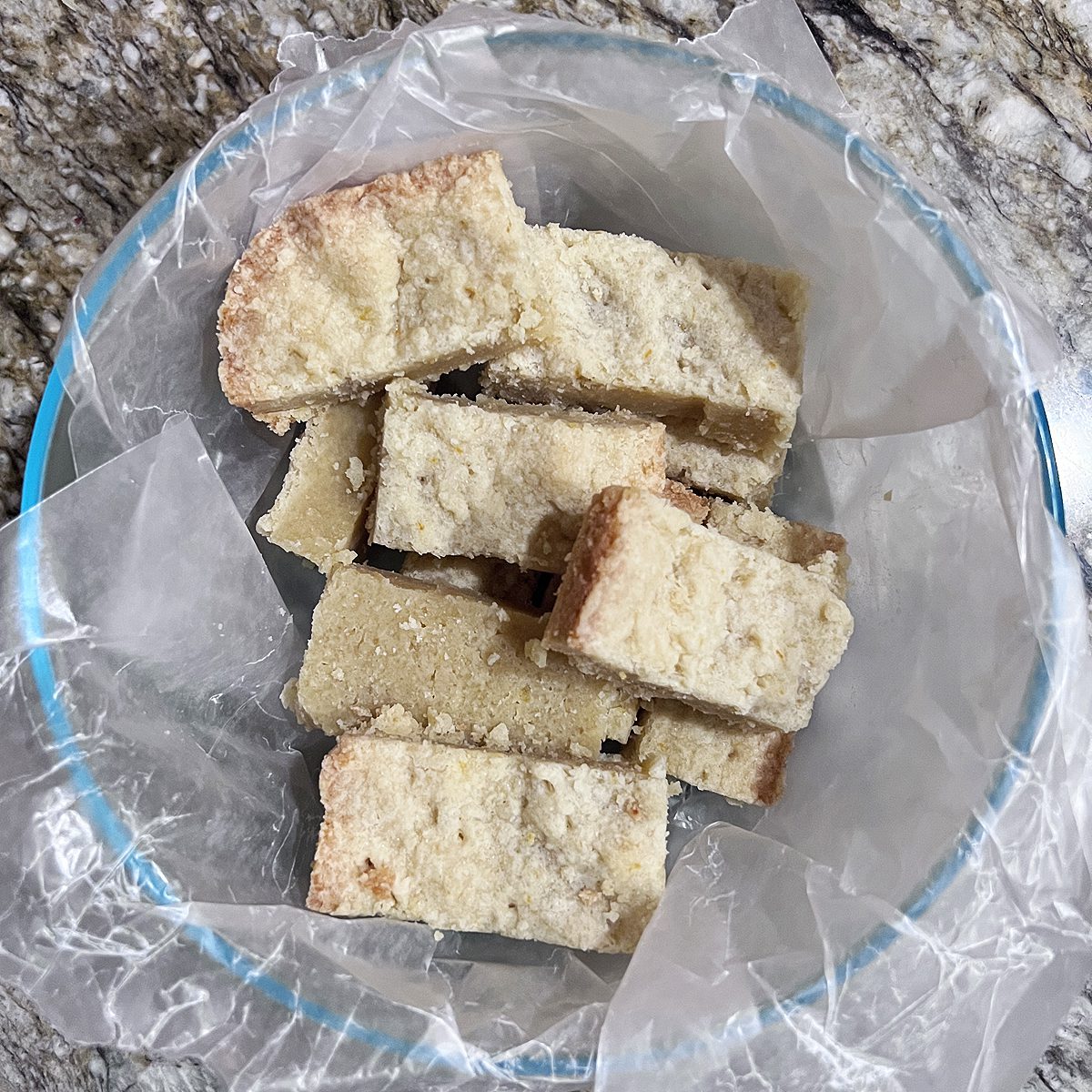 The best shortbread biscuit recipe, shortbread biscuits cut and placed in a bowl.