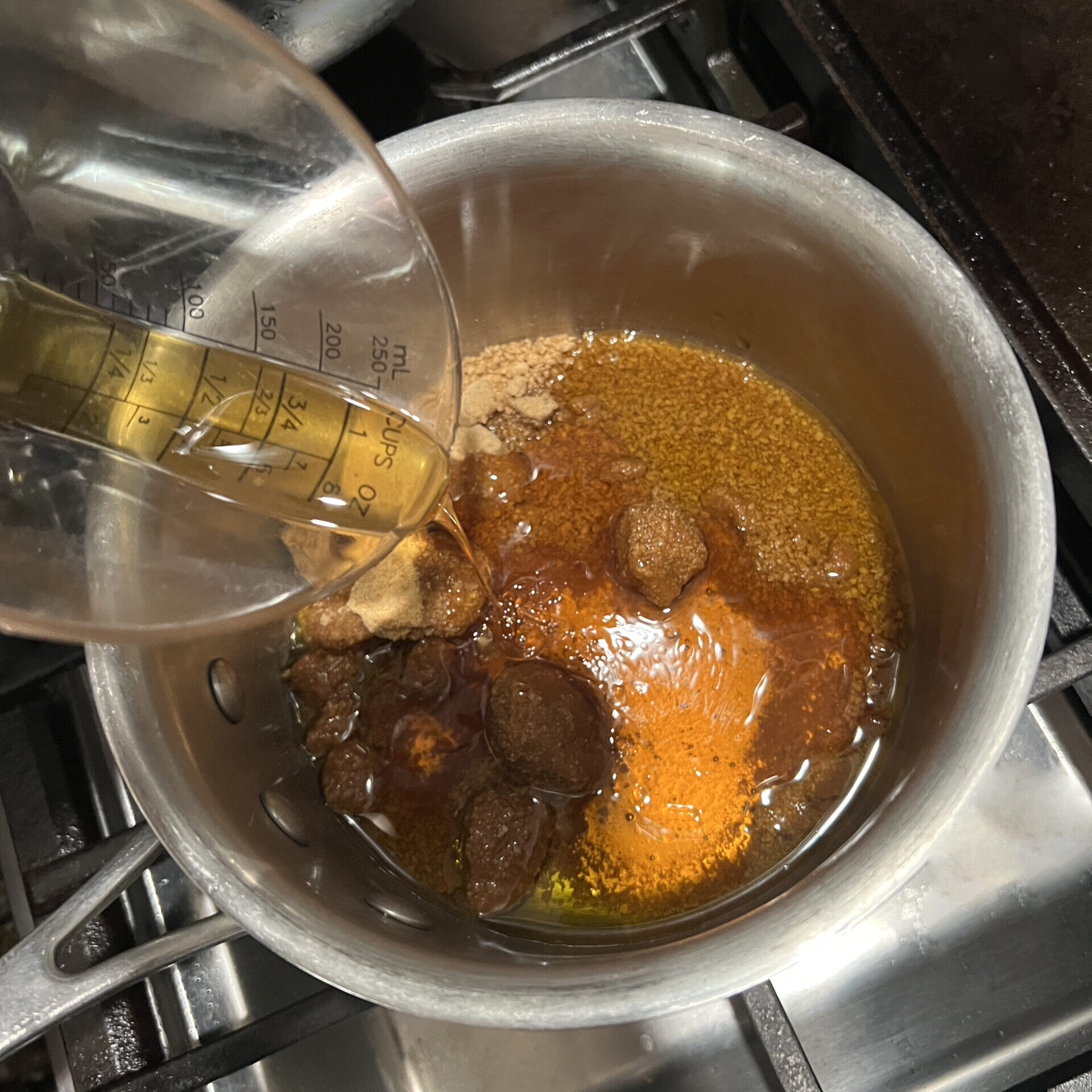 Warming up the coconut sugar, honey and olive oil for the best homemade granola recipe